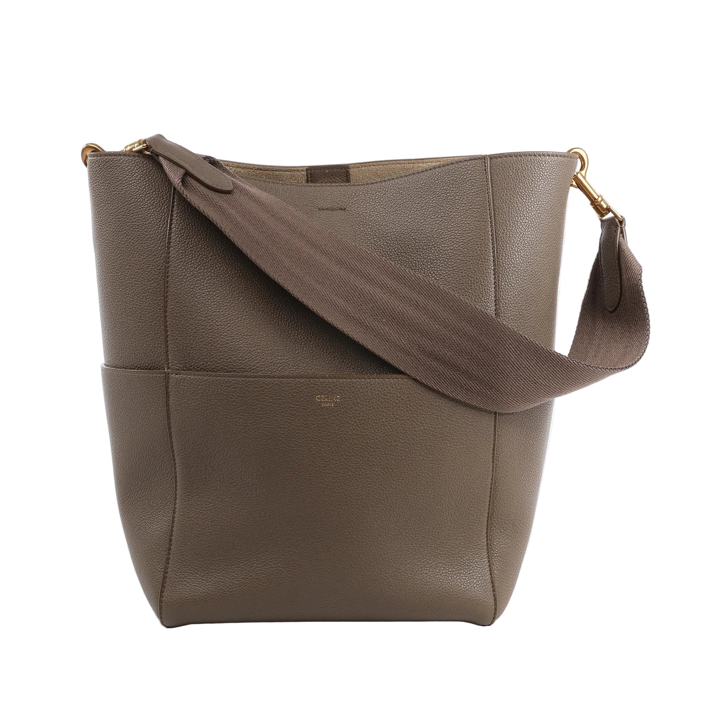 CELINE Seau Sangle Bucket Bag in greige grained leather with gold-tone hardware and wide brown fabric shoulder strap, shown standing upright against a white background.
