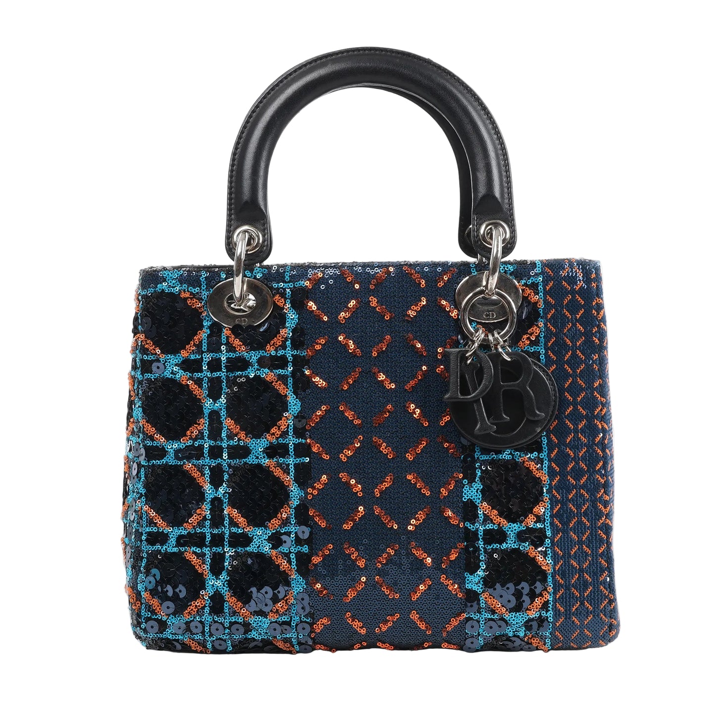 Front view of a Dior Lady Dior Medium Handbag in navy blue, embellished with orange, blue, and black sequins in geometric patterns, featuring black leather handles, silver-tone hardware, and hanging Dior letter charms, displayed against a white background.