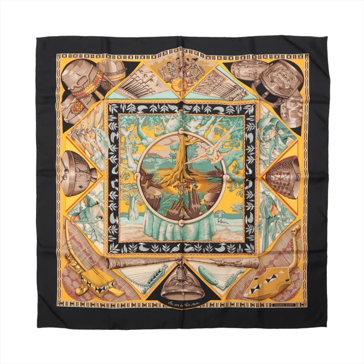 Hermès Carré 90 "Au Son du Tam Tam" silk handkerchief in black, featuring a vibrant tribal-inspired design with drums, musical instruments, and a central tree motif in yellow, turquoise, and earthy tones, bordered with geometric and symbolic patterns.