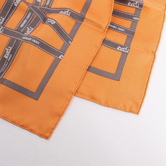 Hermès Carré 90 "Bolduc Ribbon" Silk handkerchief in Orange