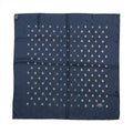 Navy blue Hermès Carré 70 silk scarf laid flat with repeating small gold-tone bee motifs and a tonal border.