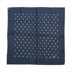 Navy blue Hermès Carré 70 silk scarf laid flat with repeating small gold-tone bee motifs and a tonal border.