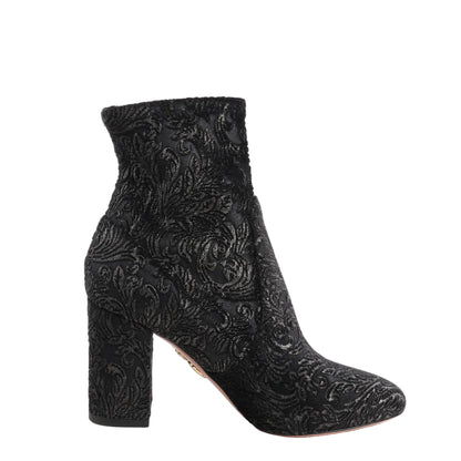 Black Aquazzura ankle sock boots in velvet featuring a tonal baroque tapestry pattern, high block heel, and sleek rounded toe in size 35.5 EU.