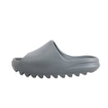 Side view of Adidas Yeezy "Slate Marine" Sandal Slide in gray, size 40 EU, showing the smooth one-piece molded EVA upper and chunky ridged sole, displayed against a white background.