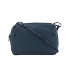 Blue Bottega Veneta Nodini crossbody bag with woven Intrecciato leather, slim shoulder strap, knotted details and zip closure.