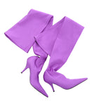 Pair of purple Balenciaga Knife thigh-high boots laid flat, with long fabric shafts, elongated pointed toes and slender heels.