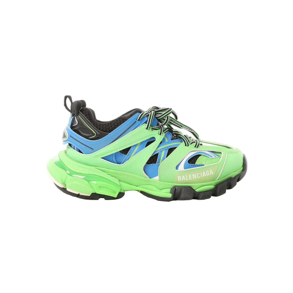 Balenciaga Track sneakers in neon green, blue and black with layered panels, mesh detailing, black-and-green laces, and chunky sole, side view on white background.