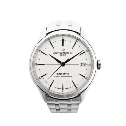 Baume & Mercier Clifton Baumatic M0A10505 automatic watch with white dial, black markers, date window at 3 o'clock, and stainless steel bracelet, shown on a white background.