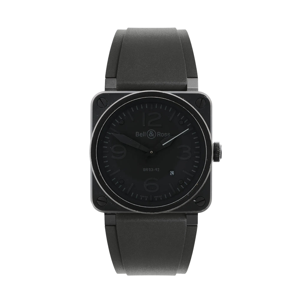 Bell & Ross BR 03-92 Phantom watch with black square case, four corner screws, black dial with large 12-3-6-9 numerals, date window, and black rubber strap.
