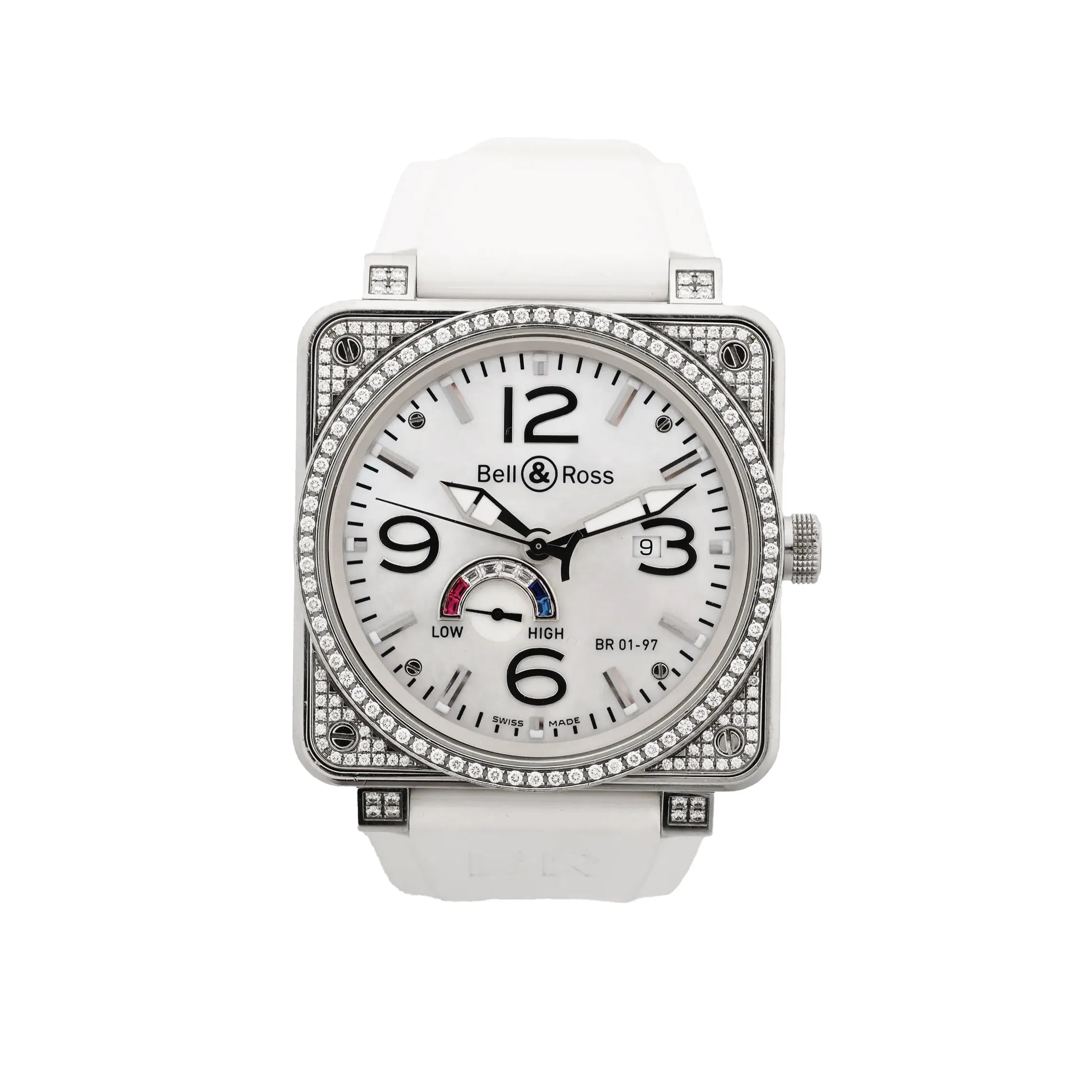 Bell & Ross square stainless steel watch with white dial, black Arabic numerals, date window, power reserve gauge, diamond-set bezel and case details, and white rubber strap.