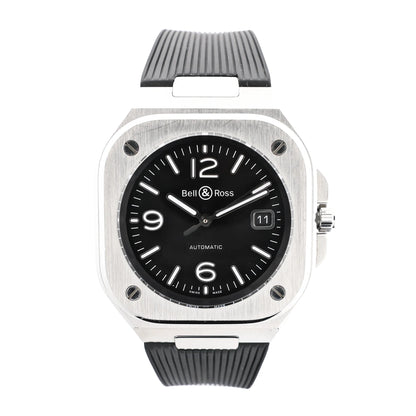Bell & Ross BR05 1103150 BR05A watch featuring a square stainless steel case, black dial with luminous numerals and hands, date window at 3 o'clock, and black rubber strap.