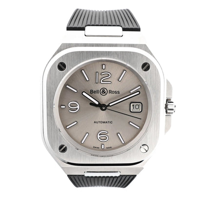 Bell & Ross BR05 BR05A-GR-ST/SRB watch featuring a brushed stainless steel square case, gray sunburst dial with white markers, date window at 3 o'clock, and textured black rubber strap.