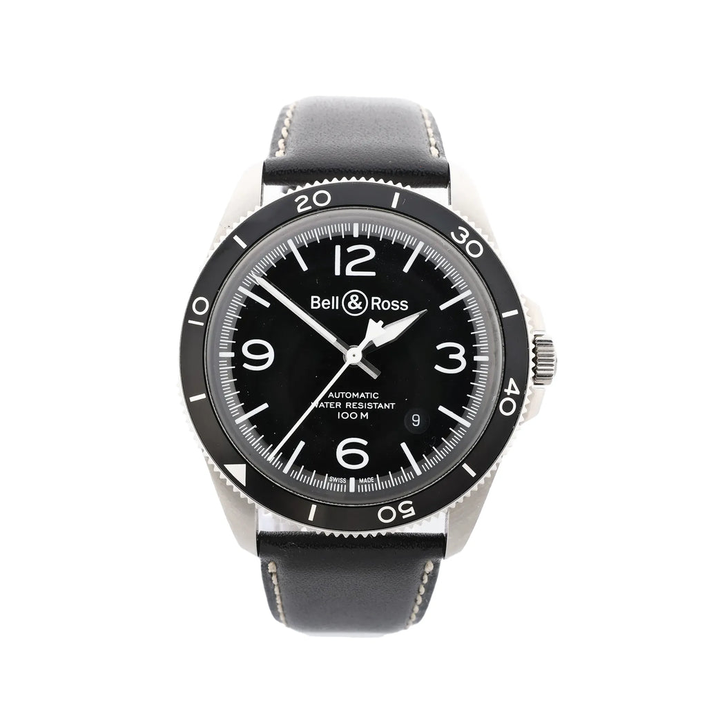 Front view of Bell & Ross BRV2-92 watch with black dial, black rotating bezel with minute markings, large 12, 3, 6, and 9 numerals, date window near 4–5 o’clock, and black leather strap with contrast stitching.