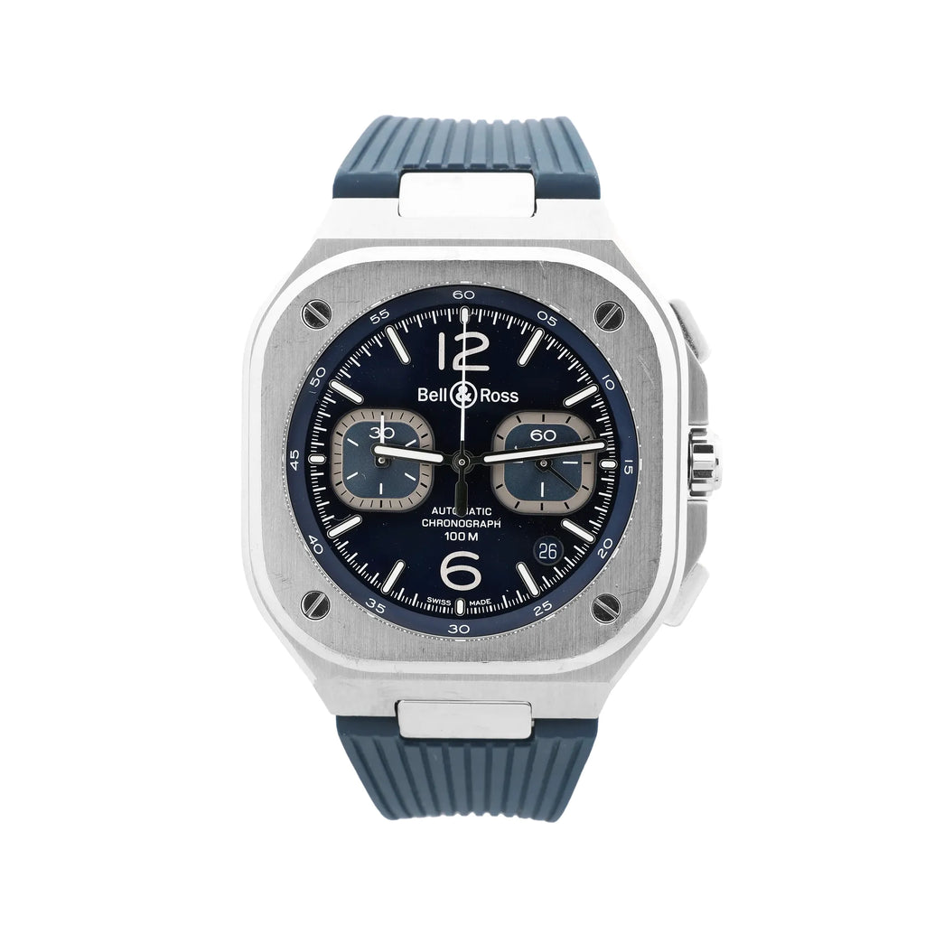 Bell & Ross BR 05 chronograph watch with square stainless steel case, blue dial, two subdials, date window at 4 o’clock, and blue rubber strap