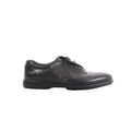 Berluti black leather lace-up shoe with calligraphy detailing on the side and low-profile black sole on white background