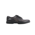 Berluti black leather lace-up shoe with calligraphy detailing on the side and low-profile black sole on white background