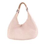 Pink Bottega Veneta Campana Intrecciato leather shoulder bag with woven body, curved hobo shape and dark metal handle rings on a white background.