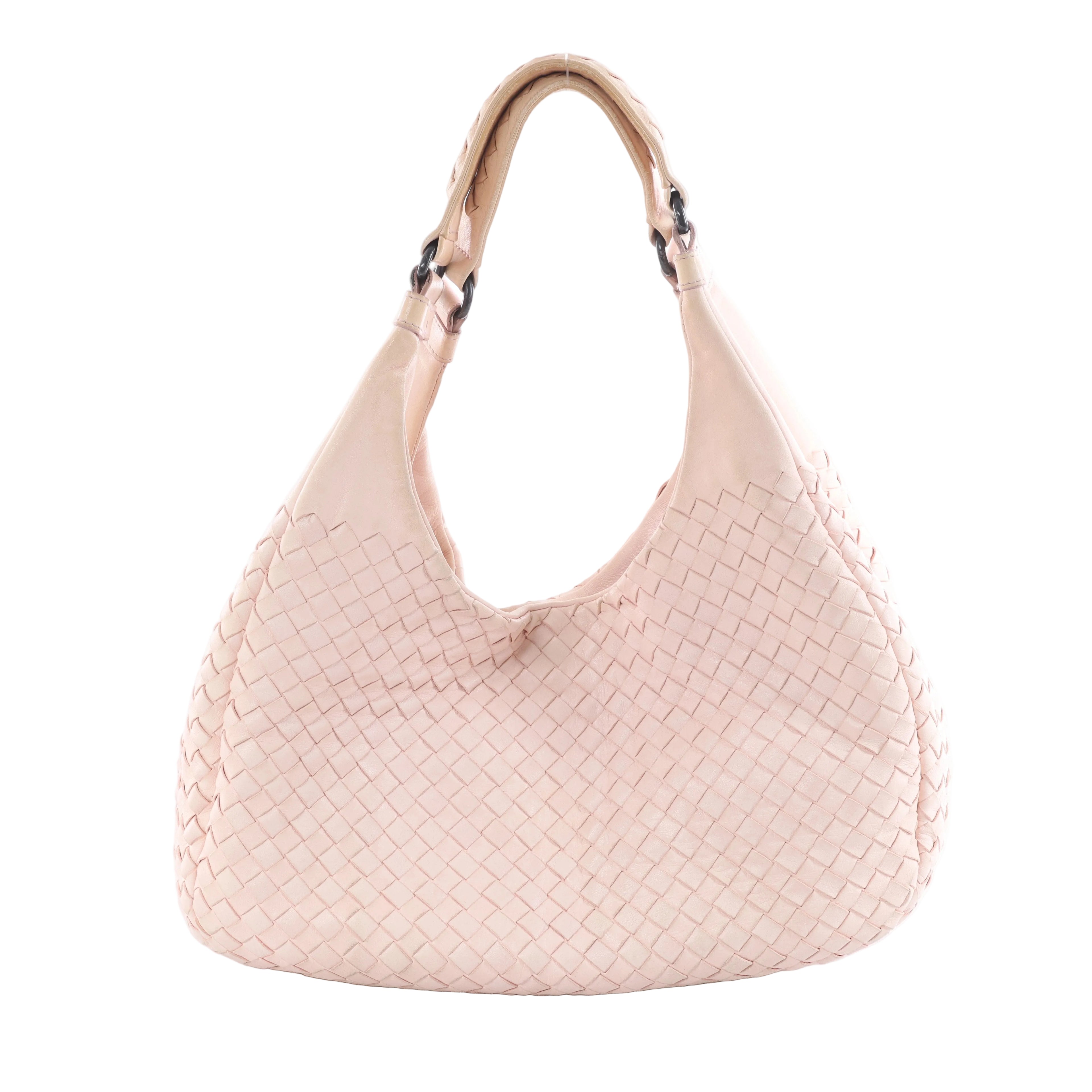 Pink Bottega Veneta Campana Intrecciato leather shoulder bag with woven body, curved hobo shape and dark metal handle rings on a white background.