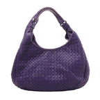 Bottega Veneta Campana shoulder bag in purple woven Intrecciato leather with a rounded silhouette, twin shoulder straps and dark metal rings.