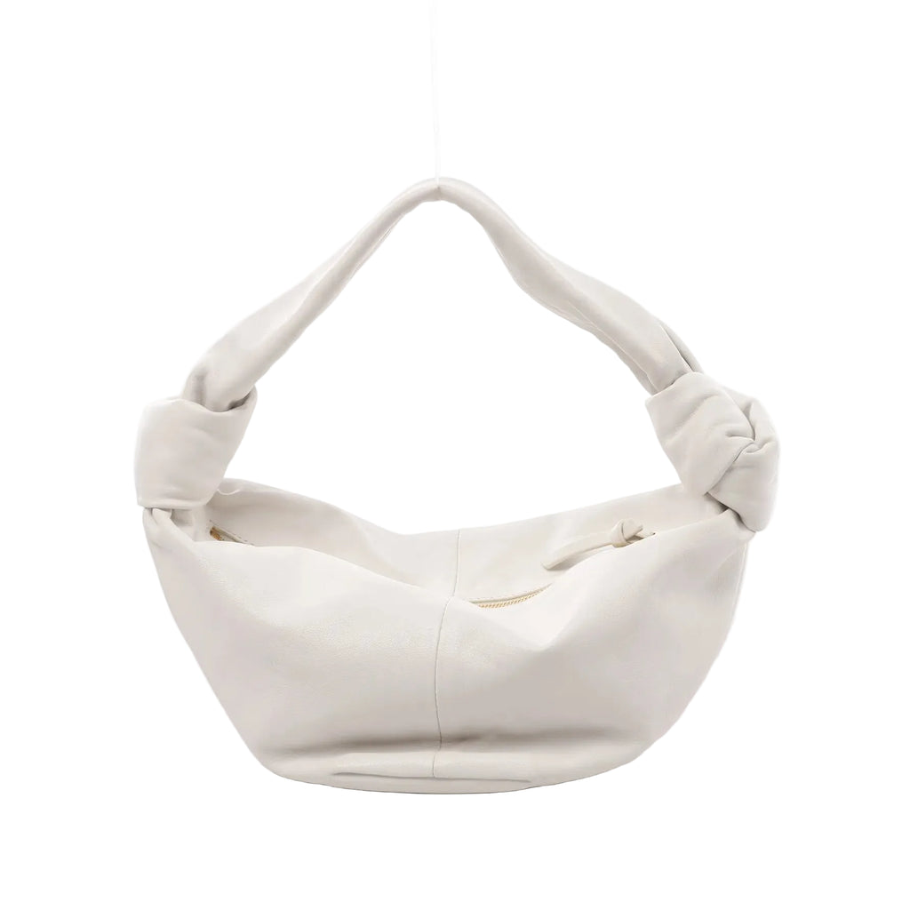 White Bottega Veneta Double Knot mini leather handbag with slouchy shape, knotted handle ends, and top zipper opening, front view on white background.