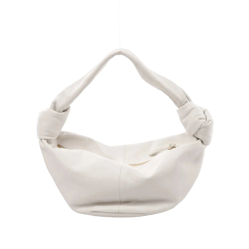 White Bottega Veneta Double Knot mini leather handbag with slouchy shape, knotted handle ends, and top zipper opening, front view on white background.