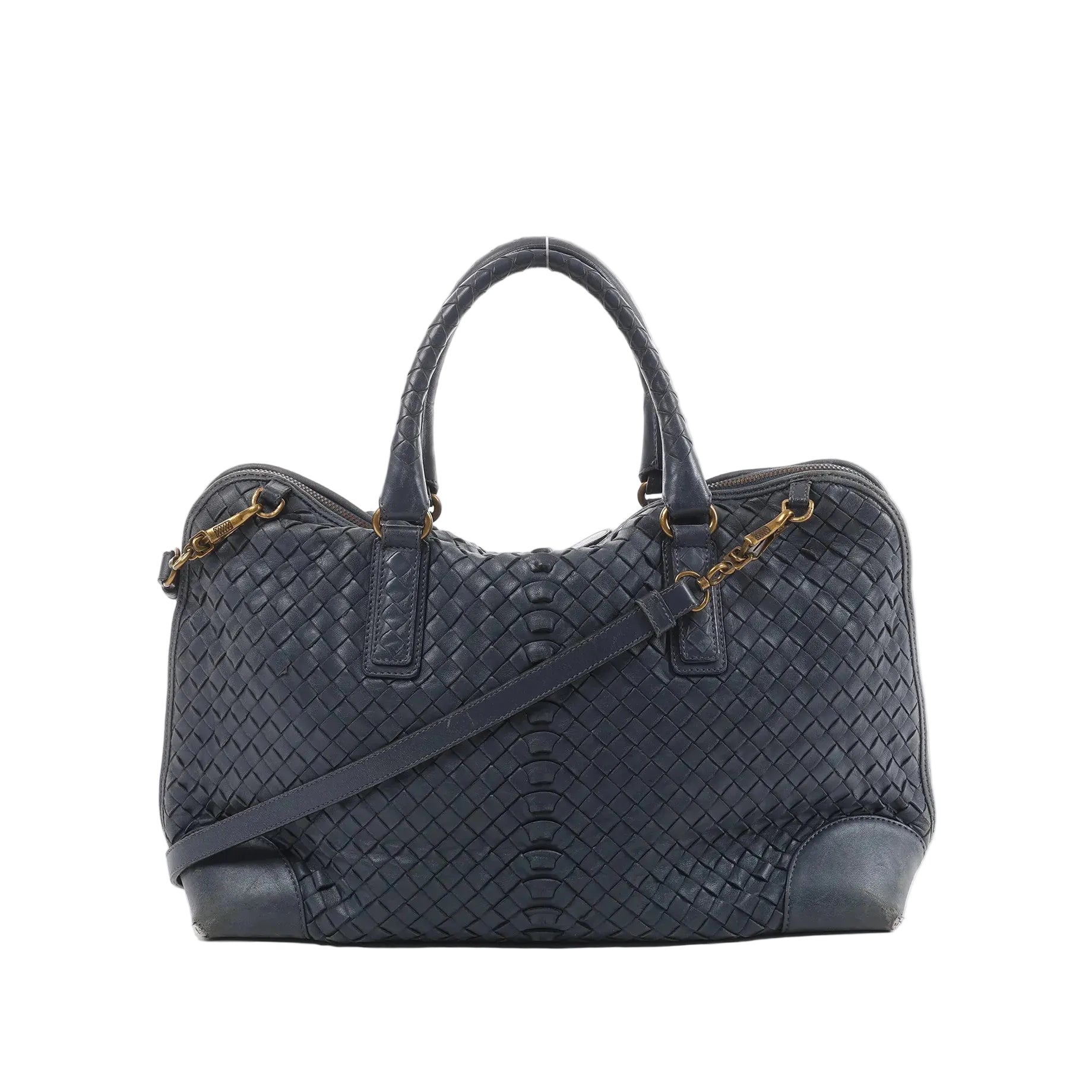 Bottega Veneta navy blue Intrecciato woven leather handbag with top handles, detachable shoulder strap, and gold-tone hardware on white background