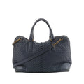 Bottega Veneta navy blue Intrecciato woven leather handbag with top handles, detachable shoulder strap, and gold-tone hardware on white background