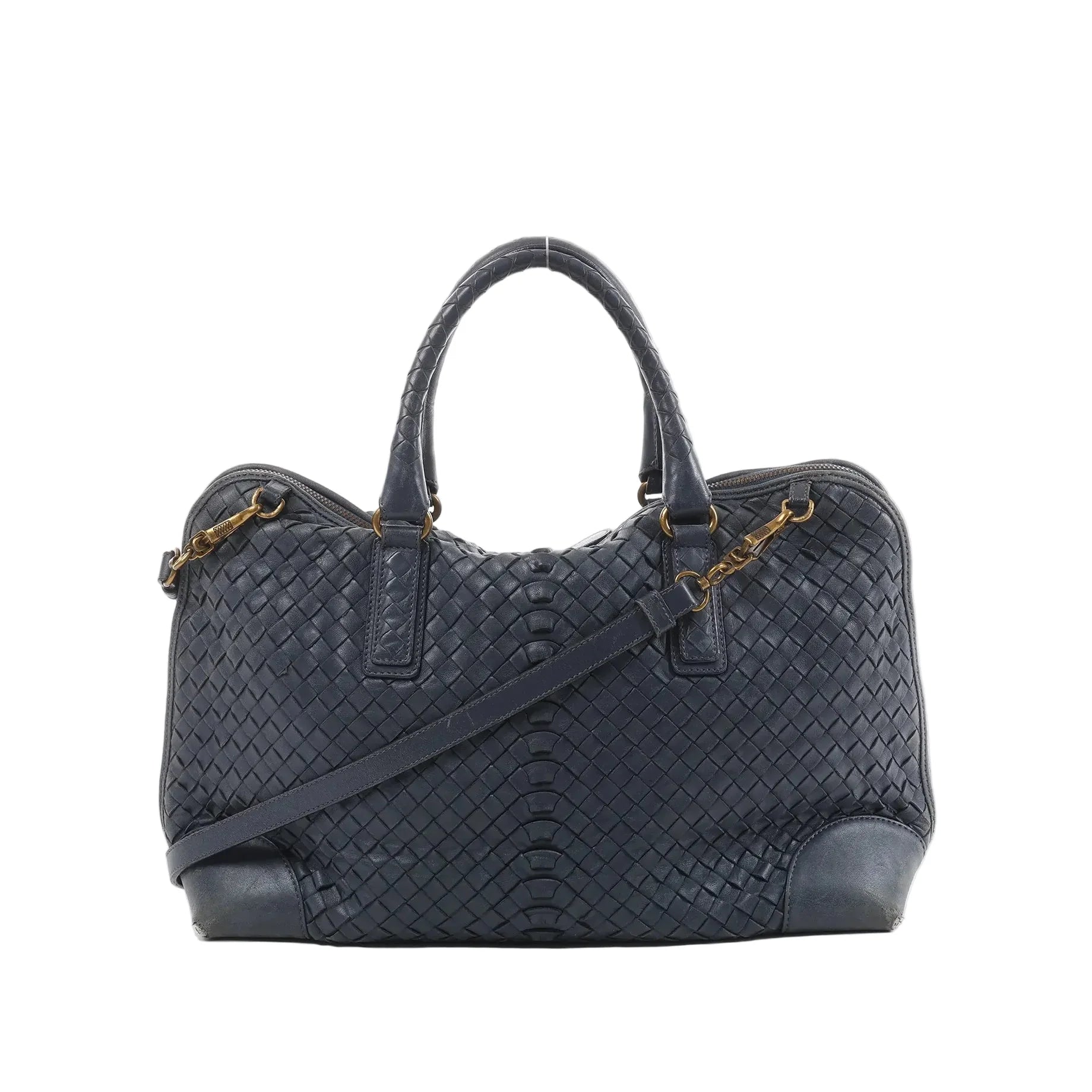 Bottega Veneta navy blue Intrecciato woven leather handbag with top handles, detachable shoulder strap, and gold-tone hardware on white background