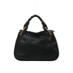 Front view of Bottega Veneta black woven leather bag with a chunky braided handle, gold-tone handle attachments and zip detailing along the sides.