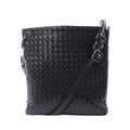 Bottega Veneta black Intrecciato woven leather messenger bag with an adjustable crossbody strap, top zip closure and dark-tone hardware.