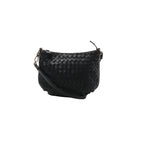 A black Bottega Veneta shoulder bag in signature Intrecciato woven leather, featuring a curved zip-top design and a slender leather shoulder strap.