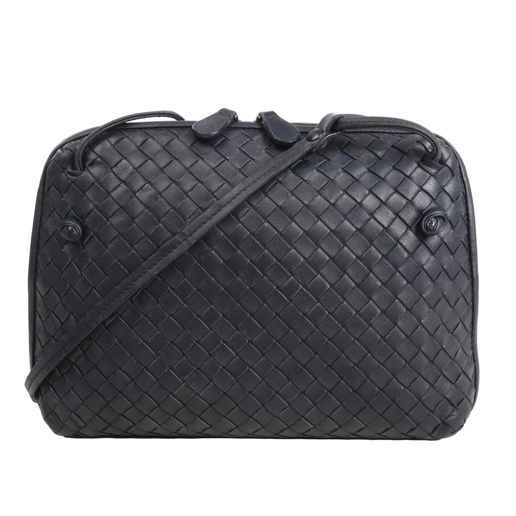 CELINE Nano Luggage 2Way handbag in black and white grained leather with top handles, front zip pocket, and detachable shoulder strap.