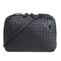 CELINE Nano Luggage 2Way handbag in black and white grained leather with top handles, front zip pocket, and detachable shoulder strap.