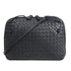 CELINE Nano Luggage 2Way handbag in black and white grained leather with top handles, front zip pocket, and detachable shoulder strap.