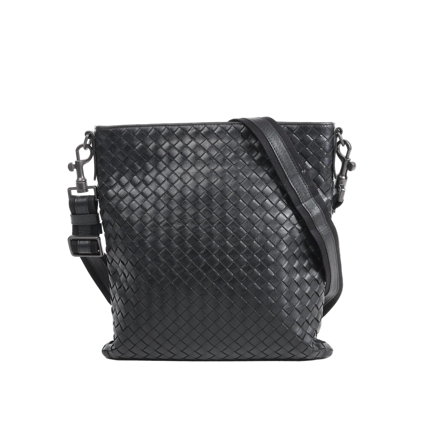 Bottega Veneta VN Nappa Intrecciato crossbody messenger bag in black woven leather with adjustable strap, slim rectangular shape, and minimalist design against a white background.