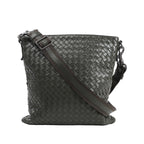 Bottega Veneta Nappa Intrecciato VN Crossbody Messenger Bag in green woven leather with an adjustable leather and fabric shoulder strap and gunmetal-tone hardware, displayed upright against a white background.