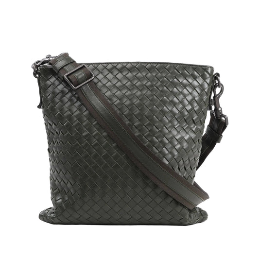 Bottega Veneta Nappa Intrecciato VN Crossbody Messenger Bag in green woven leather with an adjustable leather and fabric shoulder strap and gunmetal-tone hardware, displayed upright against a white background.