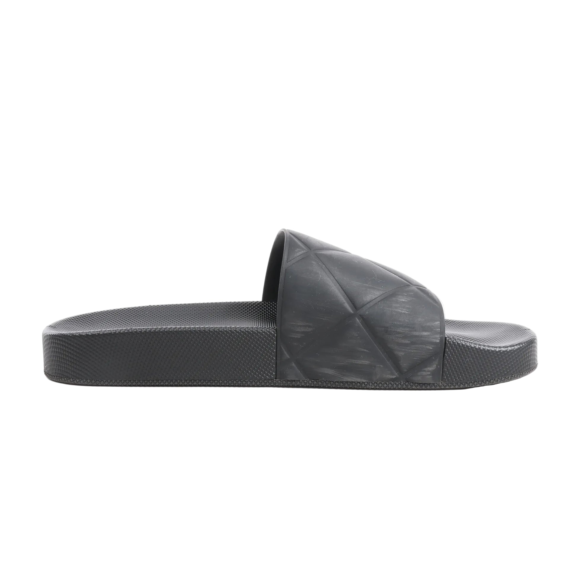 Bottega Veneta Intrecciato Rubber BV Flat Slides in black, size 40 EU, featuring a molded rubber footbed and wide strap with embossed geometric weave pattern, displayed in side profile against a white background.
