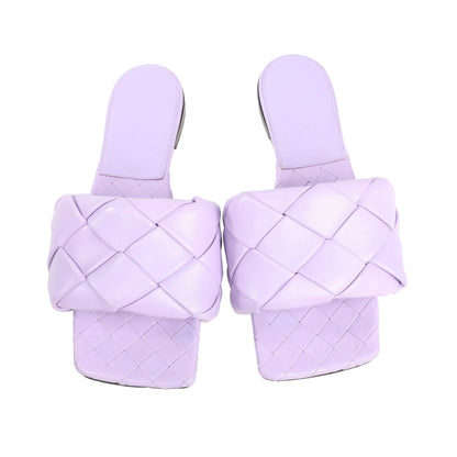 Pair of Bottega Veneta Lido sandals in purple intrecciato leather with square toe design and padded woven straps, shown in size 37 EU.