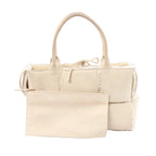 Bottega Veneta Arco Maxi Intrecciato beige leather and shearling handbag with top handles and matching zip pouch on white background.