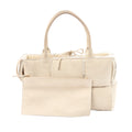 Bottega Veneta Arco Maxi Intrecciato beige leather and shearling handbag with top handles and matching zip pouch on white background.