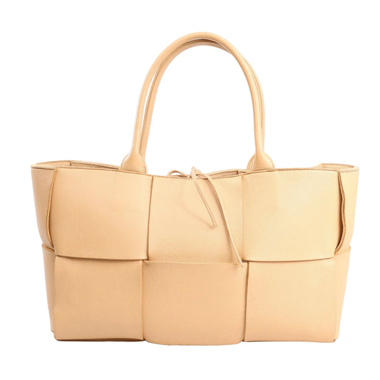 Bottega Veneta Arco Maxi Intrecciato large tote handbag in beige leather featuring oversized woven panels, double top handles, and a drawstring closure.
