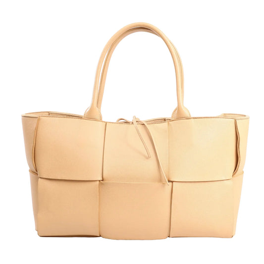 Bottega Veneta Arco Maxi Intrecciato large tote handbag in beige leather featuring oversized woven panels, double top handles, and a drawstring closure.