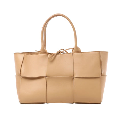 Bottega Veneta Nappa Maxi Intrecciato Medium Arco Handbag in beige woven leather with double top handles and knotted detail, displayed against a white background.