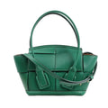 Bottega Veneta Arco Mini 2Way Handbag in green leather, featuring the brand's signature Maxi Intrecciato weave, rounded top handles, adjustable shoulder strap, and structured silhouette, displayed against a white background.