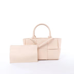 Bottega Veneta The Arco Maxi Intrecciato Leather Handbag in Pink
