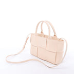 Bottega Veneta The Arco Maxi Intrecciato Leather Handbag in Pink