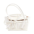 Bottega Veneta Arco Mini handbag in white leather with oversized Intrecciato weave, rounded top handles and an adjustable shoulder strap.