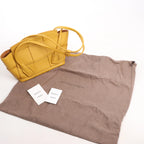 Bottega Veneta Mini Arco Maxi Intrecciato Leather Handbag in Yellow