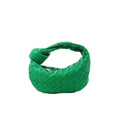 Bottega Veneta Mini Jodie handbag in bright green woven leather with a curved body and signature knotted top handle.